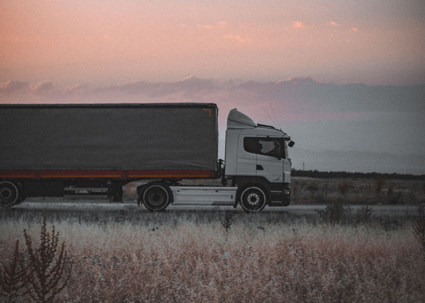 Tractor truck route selection: highway tractor trailer. Illustrative stock photo.